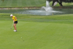 Metro Invitational winner Kristin Hearp sends her 20-foot birdie putt into the jar at Blue Hills par-4 fifth hole on her way to an 8-shot win. It was the 16-year-old, Hidden Valley junior's second straight Metro title.