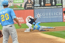 Red Sox baserunner Carlos Asuaje (dark jersey) barely beats the tag at second base by Pelican shortstop #10 Edwin Garcia during Sunday's win.