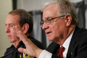 Larry Hinker, right, speaks as Virginia Tech Police Chief Wendell Flinchum, left, listens during a 2011 news conference. 